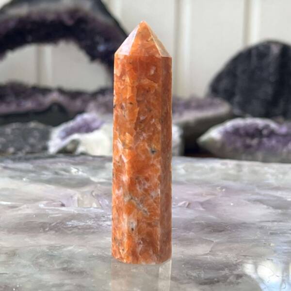 orange calcite tower point