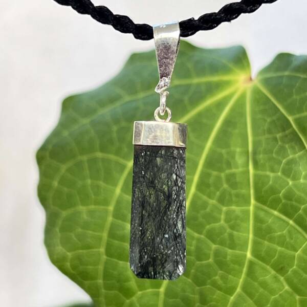 Black tourmaline in quartz pendant with a simple silver cap setting