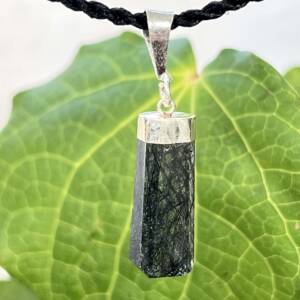 Black tourmaline in quartz pendant