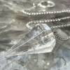 clear quartz pendulum with six sides and white metal chain